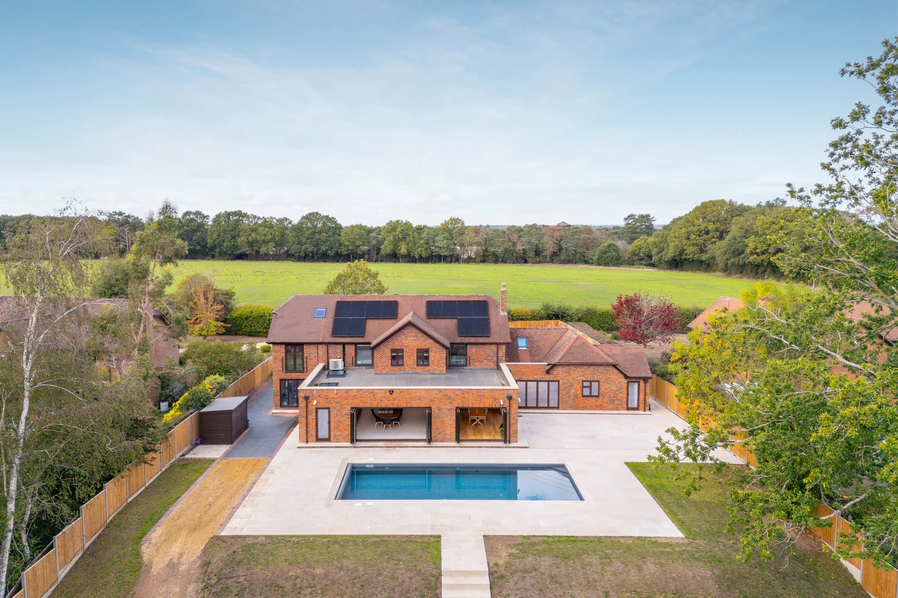 The Hollies country residence and outdoor swimming pool, surrounded by countryside
