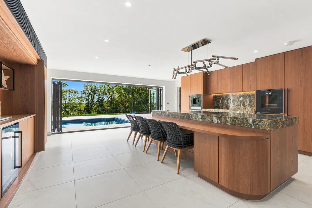 Bespoke German kitchen with a large island and glazed doors